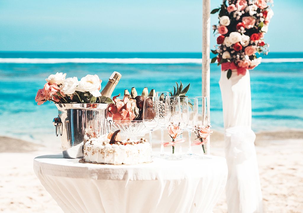 wedding elegant table with tropical fruits cake beach