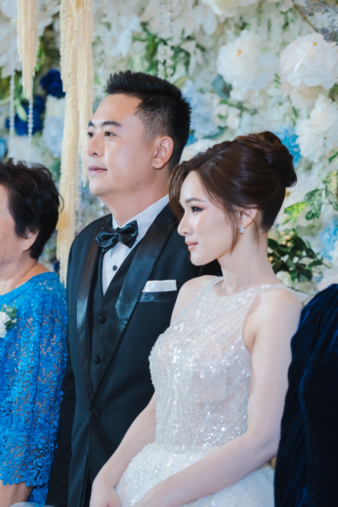 ถ่ายรูปหน้า backdrop งานแต่งคุณบูมและคุณทราย